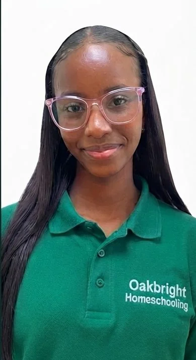 Female A-Level student holding science textbook