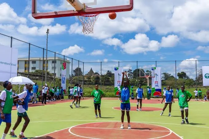 Students playing basketball during co-curricular sports activity